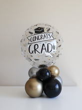 Load image into Gallery viewer, Graduation Bubble Balloon Centerpiece – Congrats Grad Air-Filled Stack (Black, Gold &amp; Silver)
